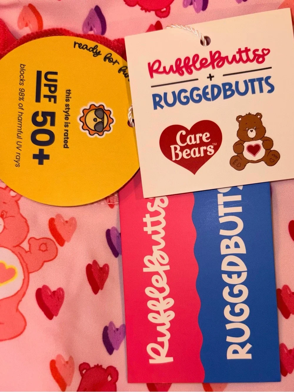 Ruffle Butts X Care Bears long sleeve 1 piece swimsuit/rashguard sz 12-18 mo NWT